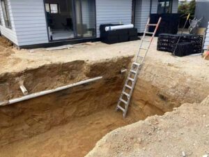 Système d’infiltration des eaux de pluie dans un jardin résidentiel en Australie et en Nouvelle-Zélande